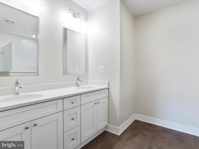 bathroom with vanity and tile patterned floors