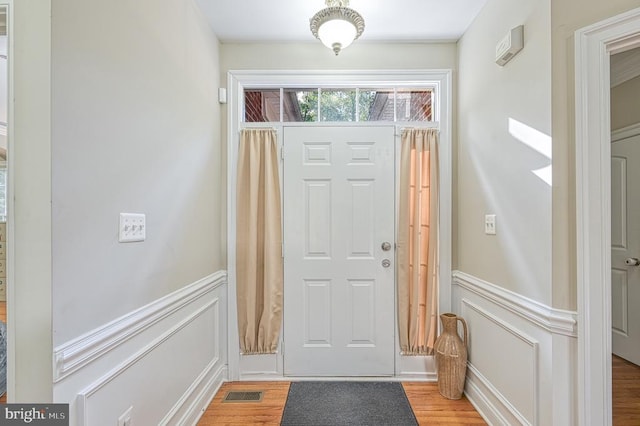 doorway to outside with hardwood / wood-style floors