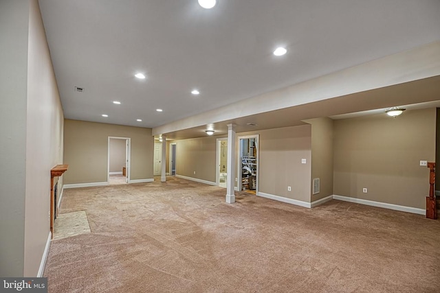 basement featuring light carpet