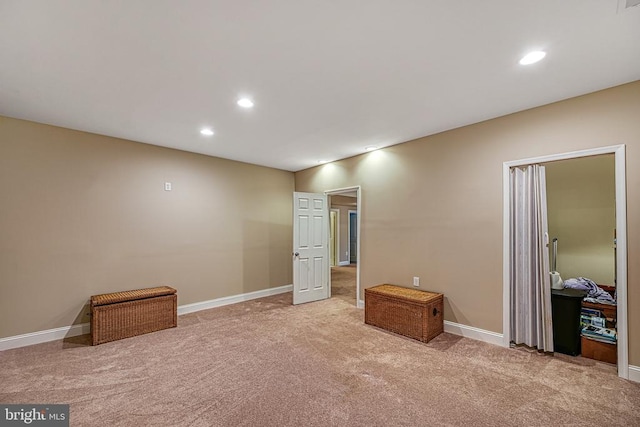 unfurnished bedroom with light colored carpet