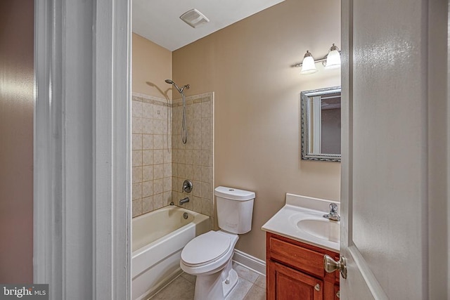 full bathroom featuring tile patterned floors, vanity, toilet, and tiled shower / bath combo