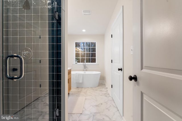 bathroom featuring separate shower and tub