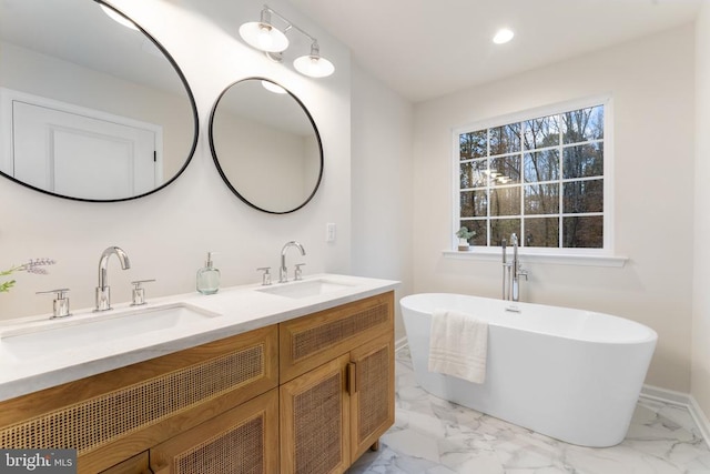 bathroom featuring a tub and vanity