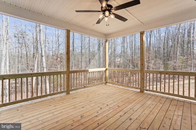 wooden terrace featuring ceiling fan