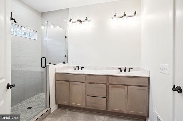 bathroom with an enclosed shower and vanity