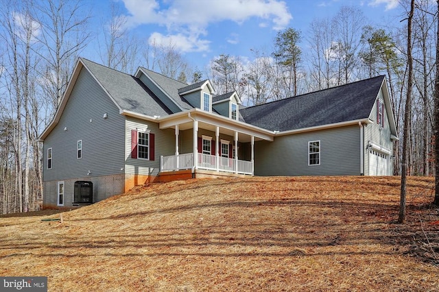 exterior space with a porch and a garage