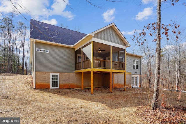 back of house with ceiling fan