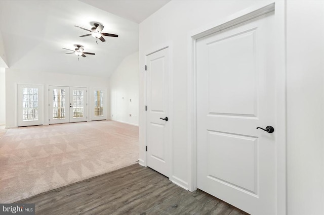 interior space featuring dark wood-type flooring, ceiling fan, french doors, and lofted ceiling