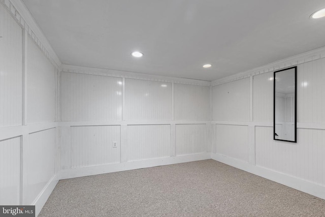 unfurnished room with carpet flooring and ornamental molding