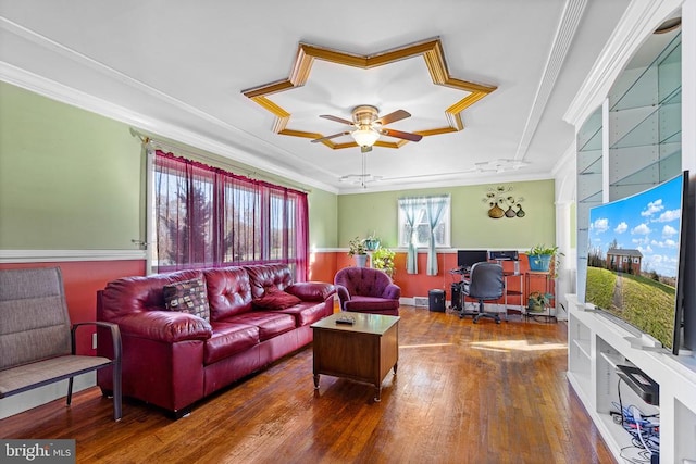 living room with ceiling fan, dark hardwood / wood-style flooring, and ornamental molding