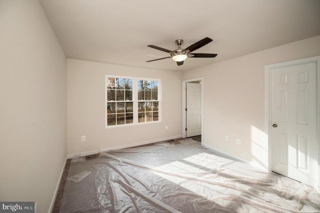 unfurnished bedroom featuring ceiling fan and light carpet