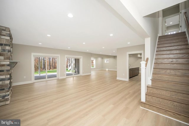 unfurnished living room with light hardwood / wood-style floors