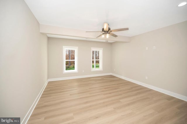 spare room featuring ceiling fan and light wood-type flooring