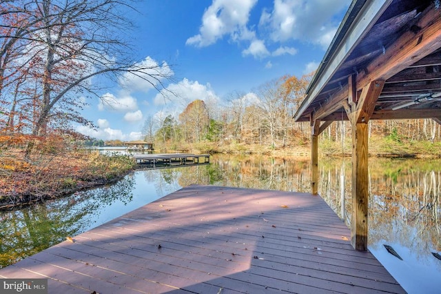 dock area featuring a water view