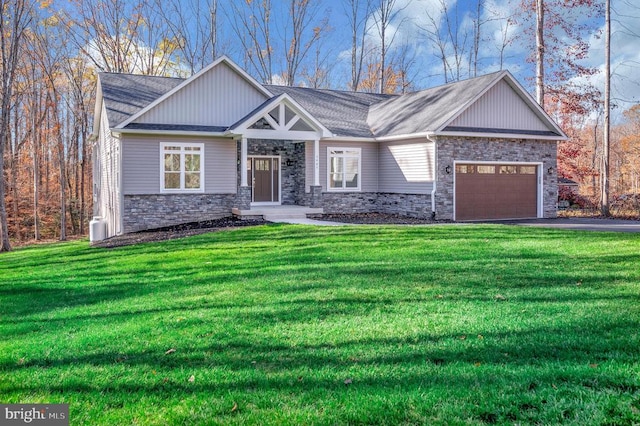 craftsman-style house with a garage and a front lawn