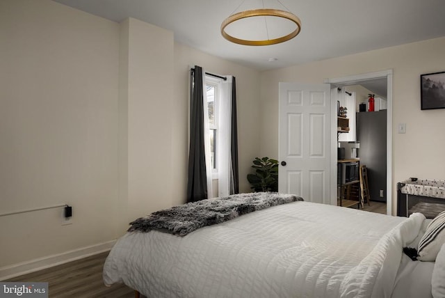 bedroom with dark hardwood / wood-style floors