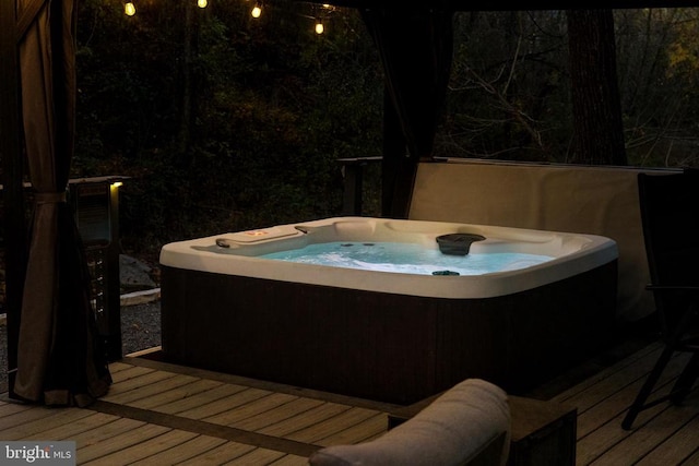 deck with a hot tub