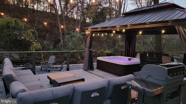 view of patio with a gazebo, an outdoor hangout area, a deck, and a hot tub