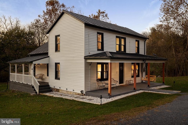 exterior space featuring a porch and a front lawn