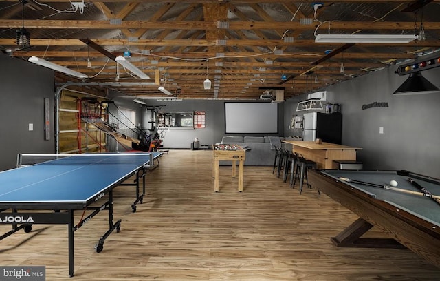 rec room featuring hardwood / wood-style floors, lofted ceiling, and billiards