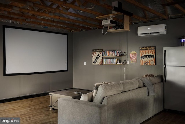 home theater with wood-type flooring and an AC wall unit