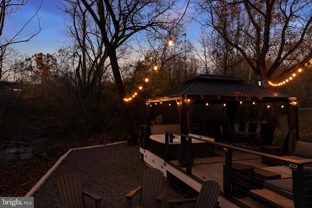 deck at dusk with a gazebo