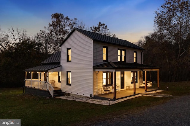 view of front of home with a lawn