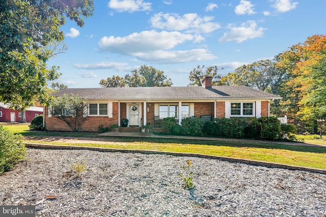 ranch-style home featuring a front yard