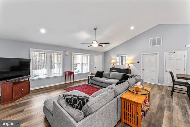 living room featuring ceiling fan, wood-type flooring, and high vaulted ceiling