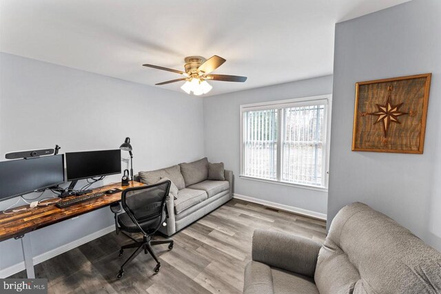 office area with wood-type flooring and ceiling fan