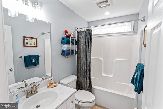 full bathroom with shower / bath combination with curtain, toilet, and vanity