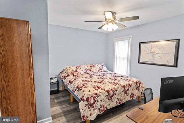 bedroom featuring hardwood / wood-style floors and ceiling fan