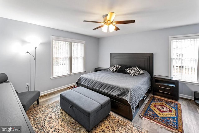 bedroom featuring hardwood / wood-style floors and ceiling fan