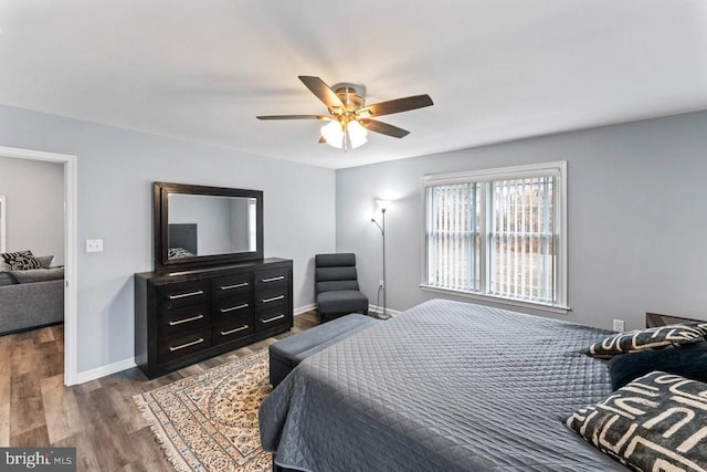 bedroom with hardwood / wood-style flooring and ceiling fan