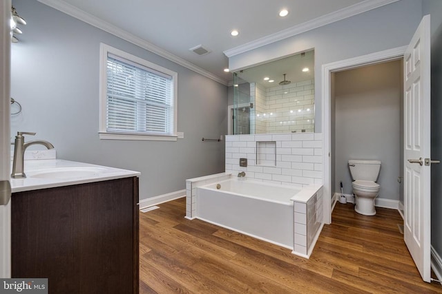 full bathroom featuring separate shower and tub, crown molding, wood-type flooring, toilet, and vanity