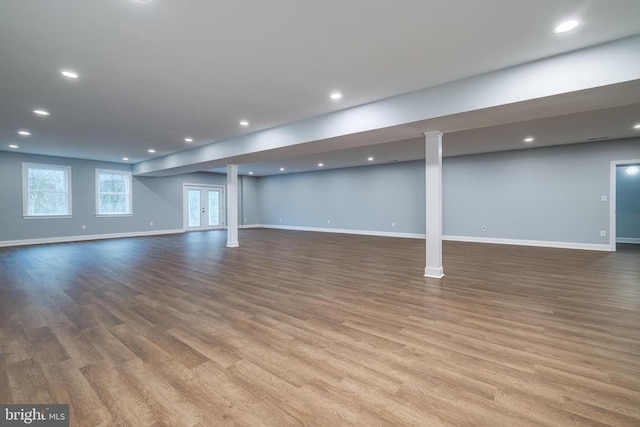 basement featuring hardwood / wood-style floors