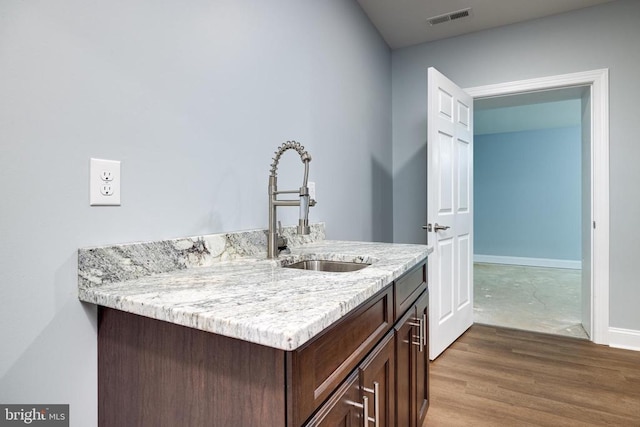 bathroom featuring wood-type flooring and vanity