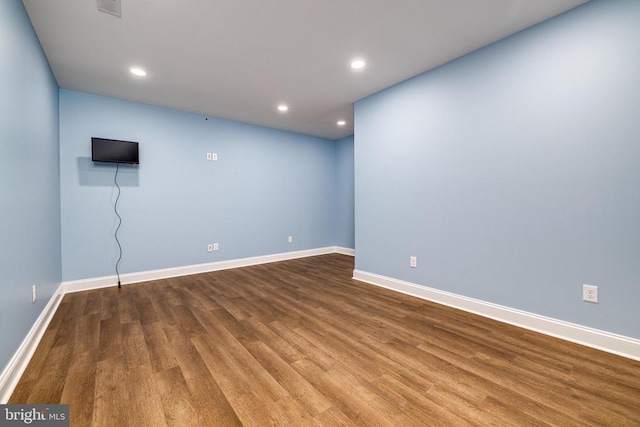 spare room featuring hardwood / wood-style flooring