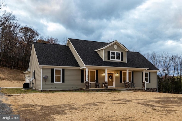 view of front of house with a porch and central air condition unit