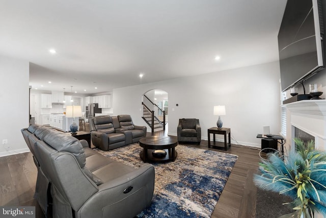 living room featuring dark wood-type flooring