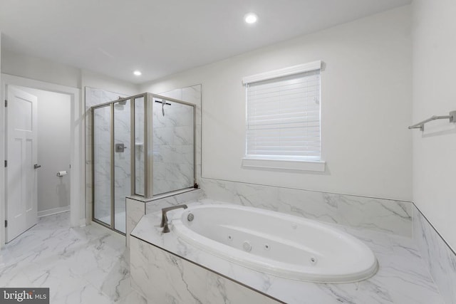 bathroom with shower with separate bathtub