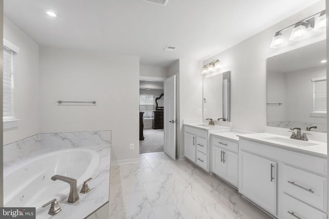 bathroom featuring a bathing tub and vanity