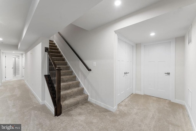 staircase with carpet floors