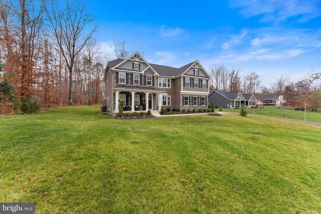 view of front of property featuring a front yard and a porch