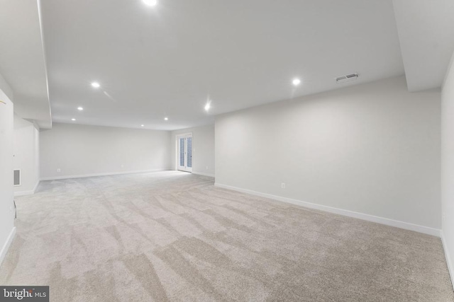 basement with light colored carpet