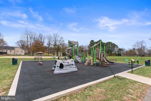 view of playground with a lawn