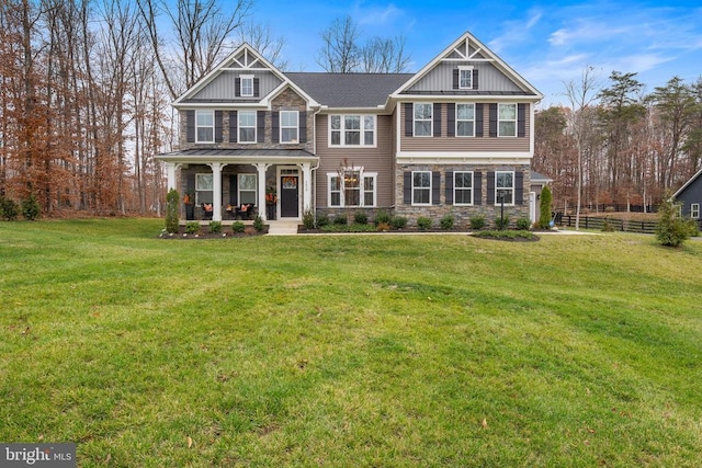 craftsman house featuring a front yard and covered porch