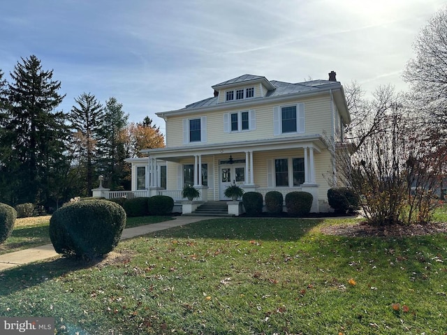 view of front property with a front lawn and a porch