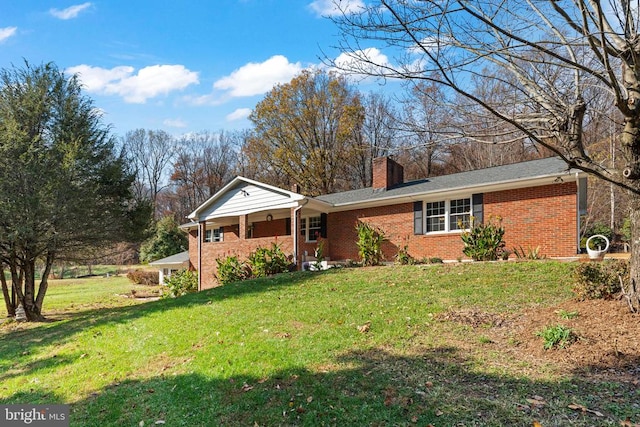 ranch-style home with a front lawn