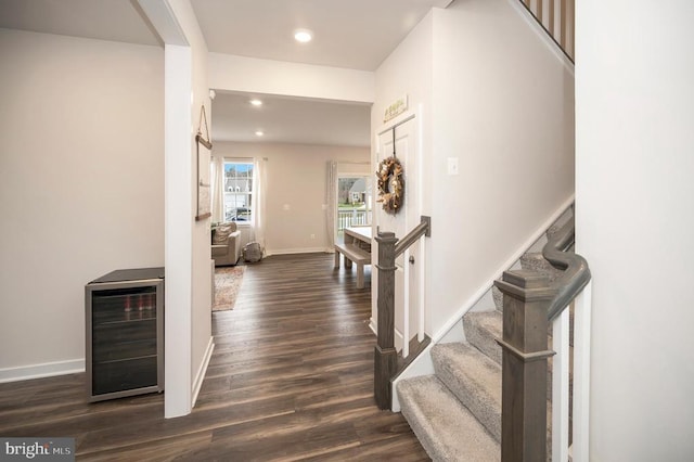 corridor featuring dark hardwood / wood-style floors and wine cooler